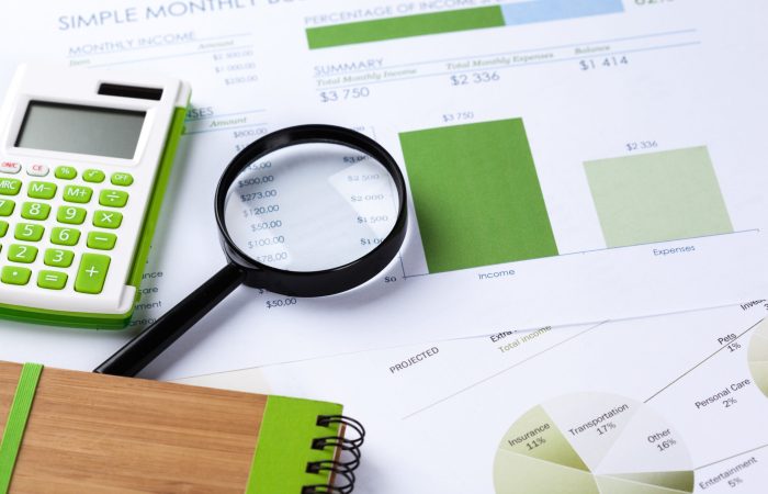 Calculator and magnifying glass on the table